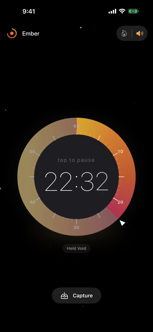 Session complete: the dial settles with a warm afterglow, the only light in a dark room